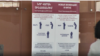 A sign at Yerevan's airport alerts passengers to the coronavirus risks.