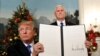 Donald Trump arătînd documentul care proclamă Ierusalimul capitală recunoscută a Israelului.