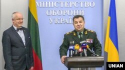 Ukrainian Defense Minister Stepan Poltorak (right) and Lithuanian counterpart Juozas Olekas appear in Kyiv in April.