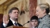 U.S. Secretary of State Hillary Clinton (right) gives the oath of office to ambassador-designate to Russia Mike McFaul in Washington on January 10.