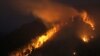 Dry grass, brush, and trees burn on the bank of the Yenisei River in Russia's Taiga district, near Krasnoyarsk, in late April, when some were already warning of the acute risk of fires.