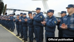 Armenian doctors, sappers, and other military personnel attend a farewell ceremony at Yerevan airport before being deployed in Syria in February. 
