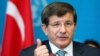 Switzerland -- Turkish Foreign Minister Ahmet Davutoglu gestures during a press conference following a meeting with United Nations High Commissioner for Refugees on September 4, 2013, in Geneva. 