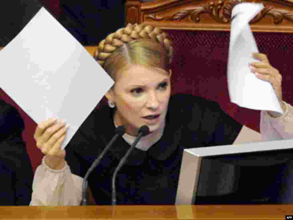 Waving documents during a debate in parliament in 2008.