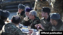 Armenia - President Serzh Sarkisian shares a meal with soldiers on frontline duty in Tavush province, 31Dec2013.