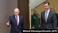 Președintele rus Vladimir Putin și președintele sirian Bashar al-Assad , Soci , 20 noiembrie 2017