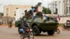 A Russian armored personnel carrier drives in the street during the delivery of armored vehicles to the Central African Republic army in Bangui in 2020.
