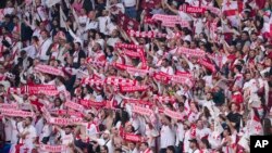 Georgian soccer fans cheer on the national team at the Euro 2024 tournament in Germany,