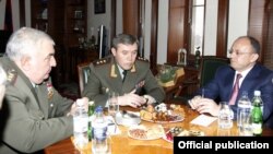 Armenia - Seyran Ohanian (R), Armenian Minister of Defence, Valery Gerasimov (C), Chief of Russian Armed Force's General Staff, and Yuri Khachaturov, Chief of Armenian Armed Force's General Staff, meet in Yerevan,15Feb,2013