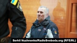 Yuriy Rossoshanskyy, seen here in court on January 9, reportedly threatened Nozdrovska at a December 27 hearing, saying, "You will end up badly."
