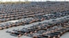 Assault rifles and missiles seized by the French Navy lie on the deck of a ship at an undisclosed location on February 1. 