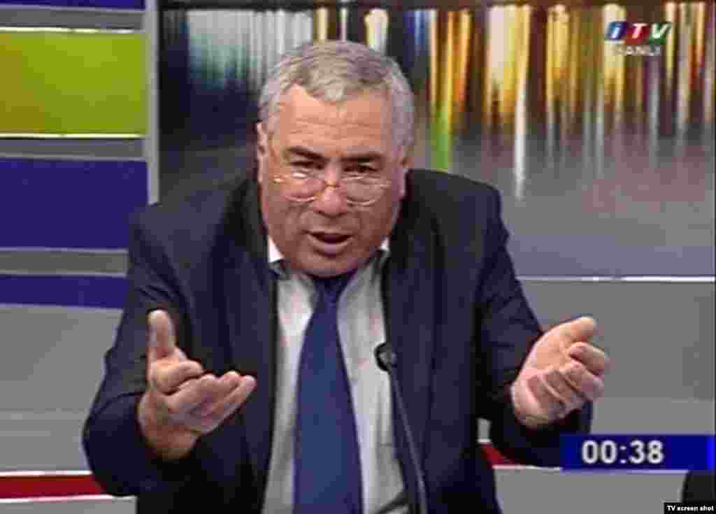 Pro-regime candidate Hafiz Haciyev, who threw a water bottle at Hasanli during one debate, has also called him a series of insulting names and said he was "immoral" for holding meetings with citizens from neighboring Armenia.