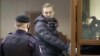 Already in prison on embezzlement charges he says were trumped up, Kremlin foe Aleksei Navalny could soon feel the full-force of Russia's anti-extremism law. (file photo)