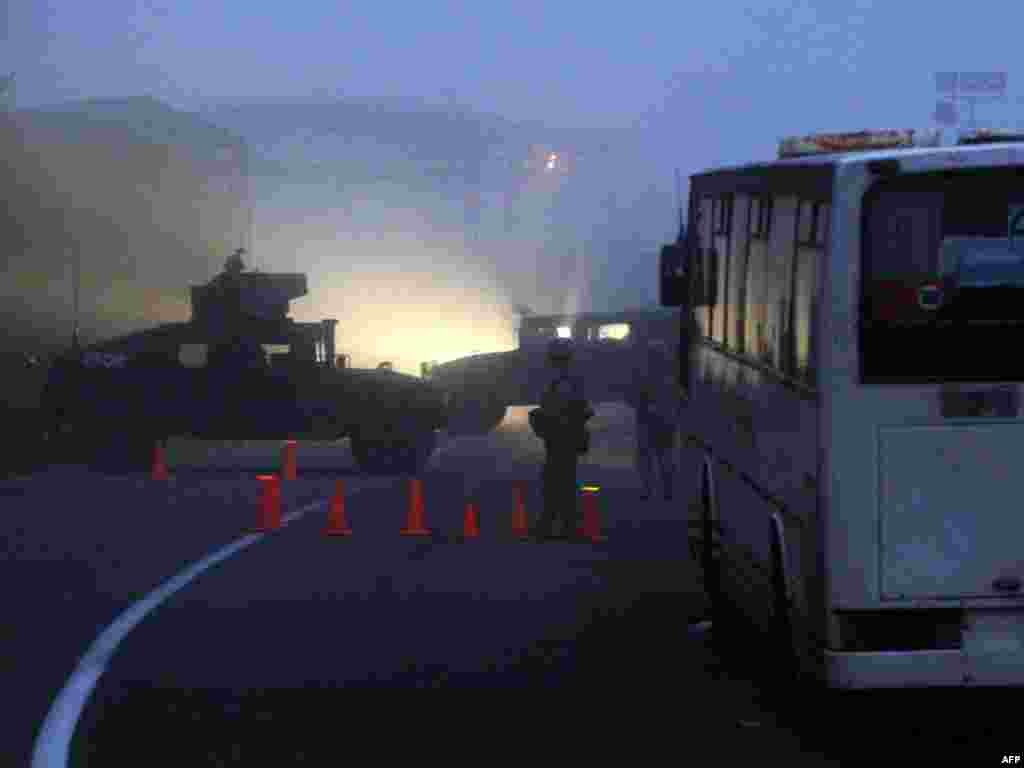 KFOR peacekeepers guard the burned-down Jarinje checkpoint on January 28.
