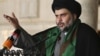 Muqtada al-Sadr delivers a sermon to worshippers during Friday Prayers at the Kufa Mosque near Najaf on May 10.