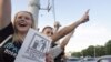 Protesters take part in a rally against a rise in gasoline prices in Minsk in June.
