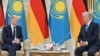 German Chancellor Olaf Scholz (left) meets in Astana with Kazakh President Qasym-Zhomart Toqaev on September 16.