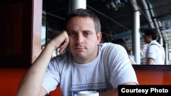 The charge stems from Russian journalist Dmitry Kolezev's 2022 online articles about atrocities allegedly committed by occupying Russian armed forces against civilians in Ukraine.