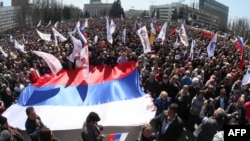 PHOTO GALLERY: Government buildings are stormed in eastern Ukraine