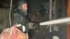 Firefighters scrambled to get blazes under control in an overnight strike on Odesa on April 16.