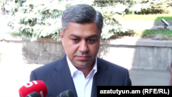 Artur Vanetsian speaks to journalists in Yerevan on August 27.