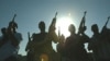 Private security guards pose on a Baghdad rooftop in September 2007.