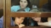 Члени групи Pussy Riot в залі суду у Москві, 30 липня 2012 року