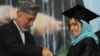 Afghan President Hamid Karzai shakes hands with a female student during a university graduation ceremony in Kabul.