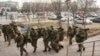 Отряд вооруженных военнослужащих в зимней экипировке. Актау, 21 декабря 2011 года.
