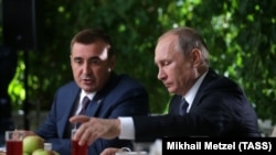 Aleksei Dyumin (left), former governor of the Tula region, previously worked as a bodyguard for President Vladimir Putin.