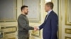 Ukrainian President Volodymyr Zelenskiy greets British Defense Secretary Grant Shapps in Kyiv on September 28.