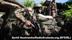 Ukrainian solders on the front line near Zolote, in eastern Ukraine, in June.