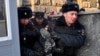 RUSSIA -- Police officers detain a protester as human rights activists gather outside the headquarters of the FSB security service, in Moscow, December 16, 2018