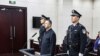 Az egykori Interpol-főnök Meng Hongwei az ellene hozott ítélet kihirdetésekor Tiencsin város bíróságán, 2020. január 21-én