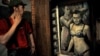 A visitor looks at Konstantin Altunin's controversial painting of Russian President Vladimir Putin and Prime Minister Dmitry Medvedev in the Museum of Authorities in St. Petersburg. 