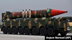 A Pakistani-made Shaheen-III missile, which is capable of carrying nuclear warheads, is carried on a trailer during a military parade in connection with Pakistan National Day celebrations in Islamabad in March 2021.
