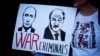 Портреты Владимира Путина и Александра Лукашенка во время протестной акции в Лондоне 26 марта 2022 года