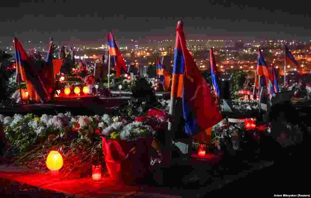 Armenian flags and candles cover Yerevan's Yerablur military cemetery on December 18. The photo was taken on the eve of three days of national mourning for those who died fighting Azerbaijani forces in and around Azerbaijan's breakaway region of Nagorno-Karabakh.