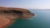 The Kempir-Abad reservoir is a vital regional water source located in the fertile Ferghana Valley.