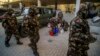 Hungarian soldiers wearing hazmat suits prepare to disinfect a kindergarten and elementary school in an effort to curb the spread of the coronavirus in Budapest on March 17.