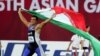 احسان حدادی در بازی آسیایی ۲۰۰۶ دوحه قطر با پرچم ایران دور افتخار می زند.