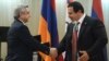Armenia - President Serzh Sarkisian and businessman Gagik Tsarukian shake hands during an awards ceremony,26Dec,2012.