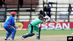 Ireland batsman Gary Wilson, right, plays a shot during their Cricket World Cup qualifier match against Afghanistan at Harare Sports Club on March 23.