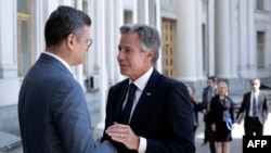 Ukrainian Foreign Minister Dmytro Kuleba (left) greets U.S. Secretary of State Antony Blinken before a meeting in Kyiv on September 6.