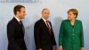 German Chancellor Angela Merkel (right) walks with French President Emmanuel Macron (left) and Russian President Vladimir Putin prior to a meeting during the G20 summit in Hamburg on July 8.