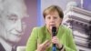 Georgia -- German Chancellor Angela Merkel gestures as she meets with students at the university in Tbilisi, Georgia August 24, 2018.