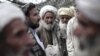 Tribal elders speak with a district governor at a shura in Helmand Province. Contact with government officials can be a death sentence for what were the unchallenged authorities in tribal politics.