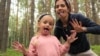 Happier times: Jailed Pussy Riot member Nadezhda Tolokonnikova with her daughter Gera.