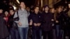 Prominent anticorruption blogger Aleksei Navalny (right) arrives for an appeal hearing at a court in Moscow on December 7. Has the Kremlin made him into an opposition icon by arresting him?