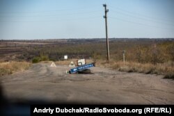 The front line in Hranitne. The hill in the background is controlled by Russia-backed separatists.
